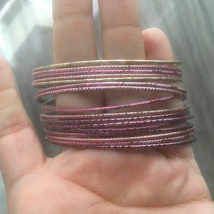 16 magenta purple and gold bangle bracelets, with red fully beaded pouch